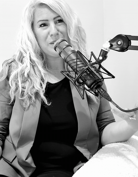 Monique in the studio, speaking into the microphone — black and white looping clip