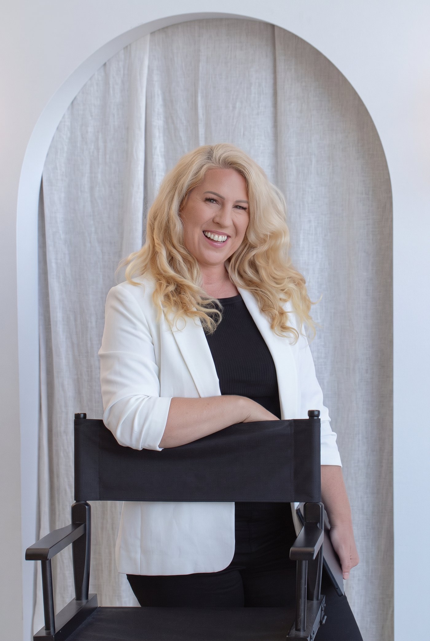 Portrait of Monique in a white blazer